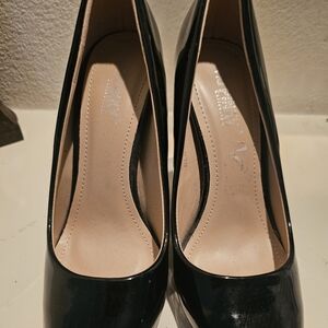 Luxe Patent Round-Toe Pumps in Glossy Black